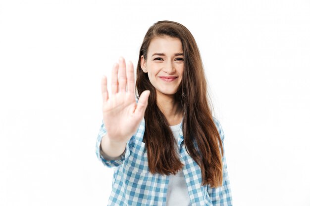 Portrait of a smiling woman giving high five to camera