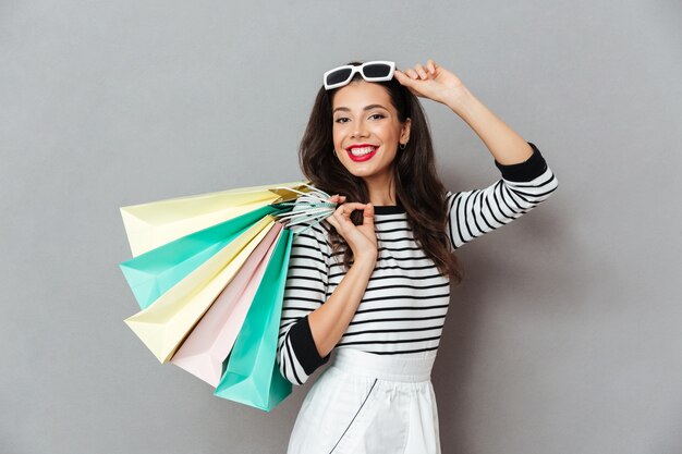 Portrait of a smiling woman holding shopping bags