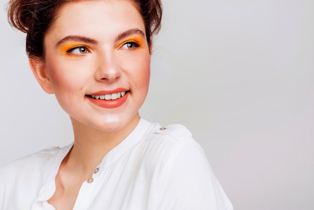 Portrait of smiling woman looking away