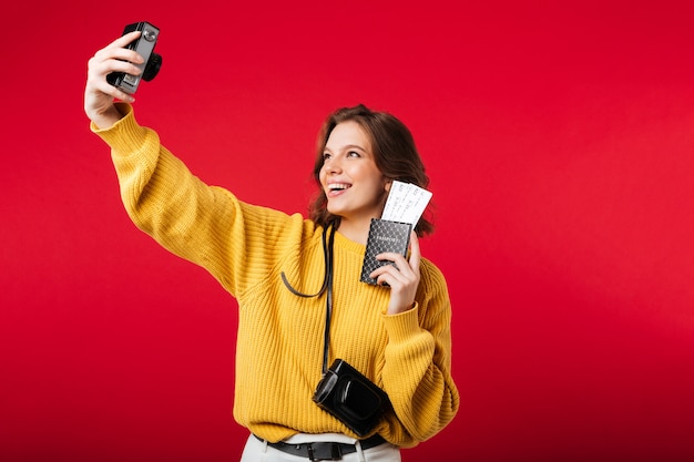 Portrait of a smiling woman taking a selfie