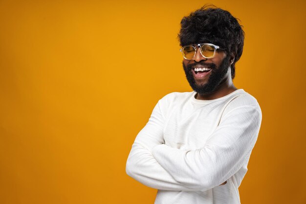 Portrait of smiling young black man in studio