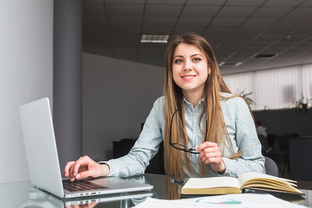 Portrait of a smiling young businesswoman in office