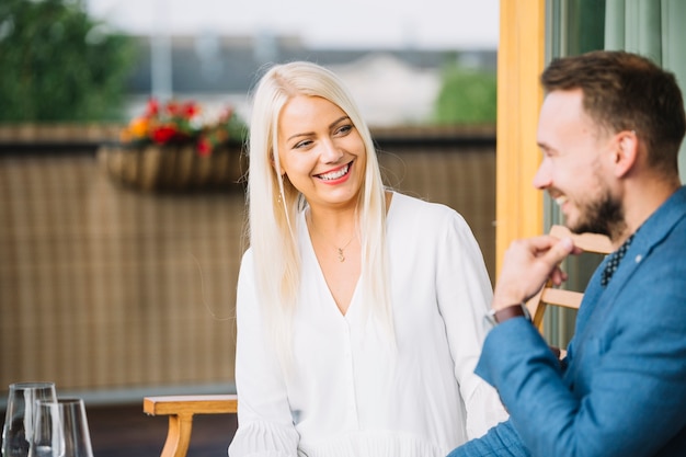 Free photo portrait of smiling young couple looking at each other