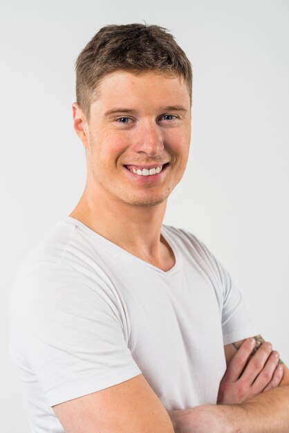 Portrait of smiling young man isolated on white background