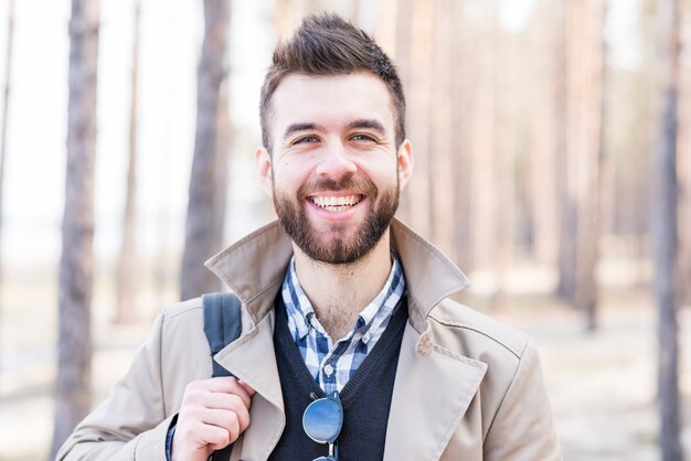 Portrait of a smiling young man looking at camera