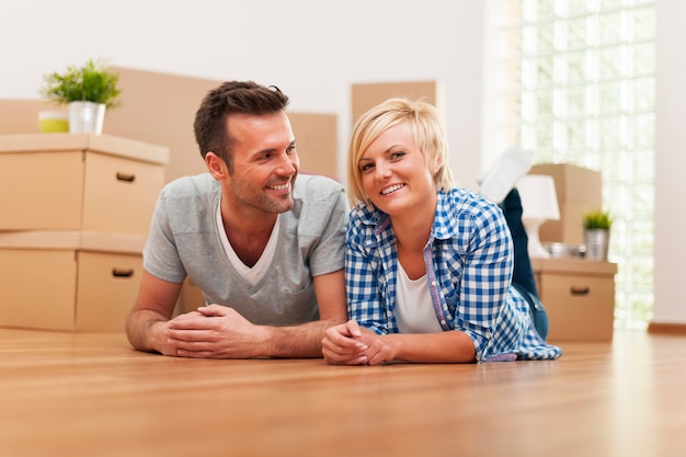 Portrait of smiling young marriage in new home