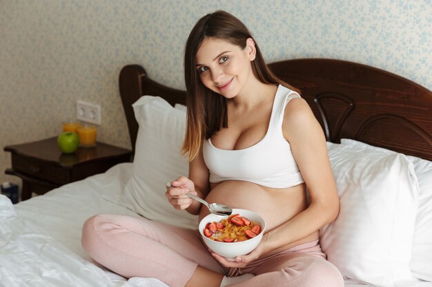 Portrait of a smiling young pregnant woman