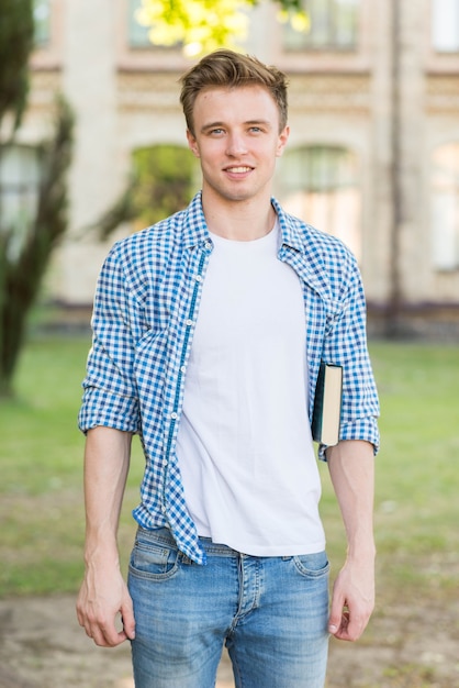 Portrait of student in front of building