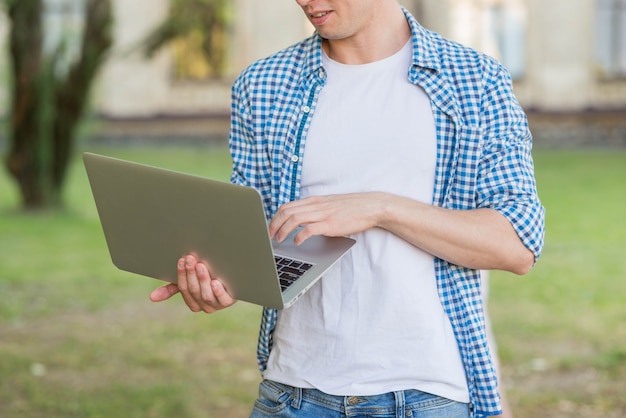 Portrait of student with laptop