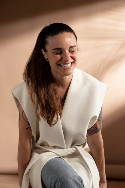 Portrait of stylish brunette woman posing and smiling