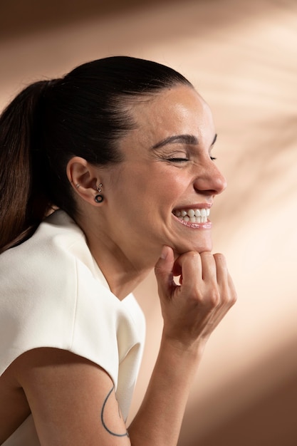 Portrait of stylish brunette woman posing and smiling