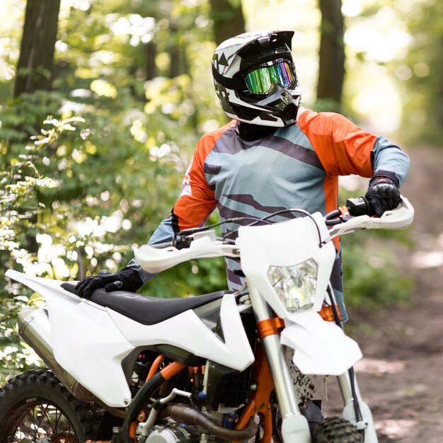 portrait of stylish motorbike rider looking away