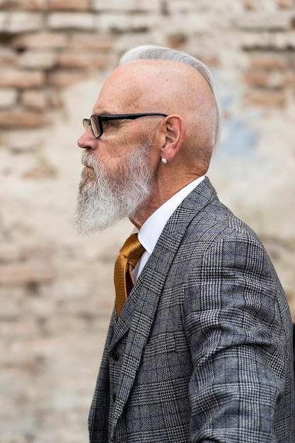 Portrait of stylish senior man sitting