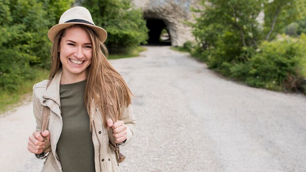 Portrait of stylish traveller with hat smiling