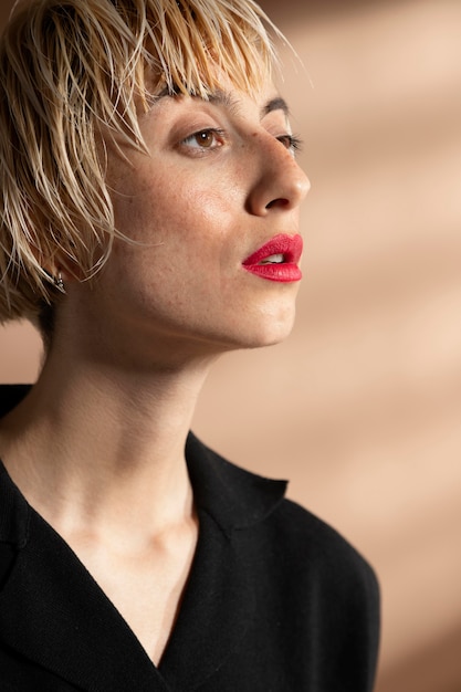 Portrait of stylish woman posing in a fashionable outfit