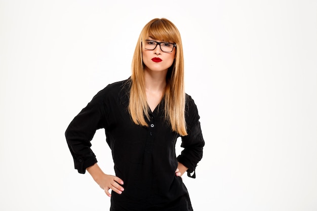 Portrait of successful businesswoMan standing over white wall Copy space