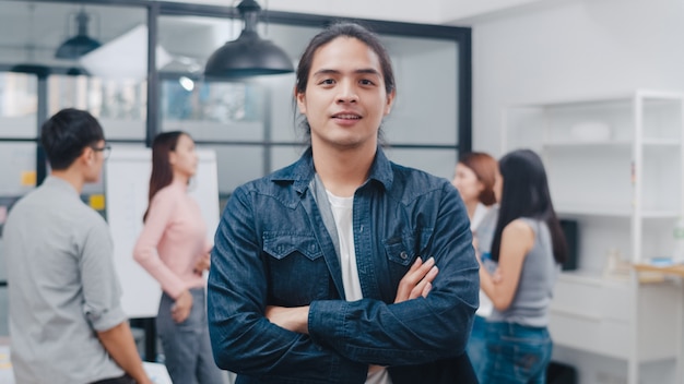 Portrait of successful handsome executive businessman smart casual wear looking at camera and smiling