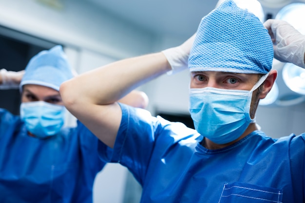 Portrait of surgeon wearing mask in operation room