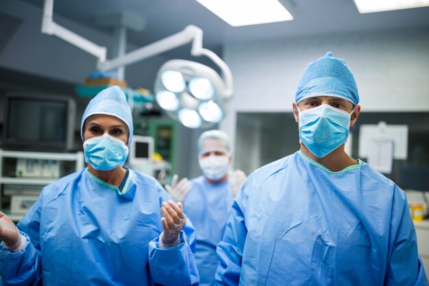 Portrait of surgeons standing in operation room