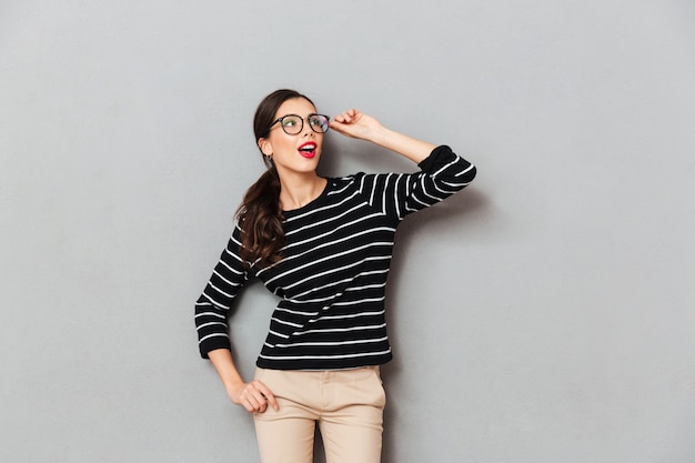 Portrait of a surprised businesswoman in eyeglasses