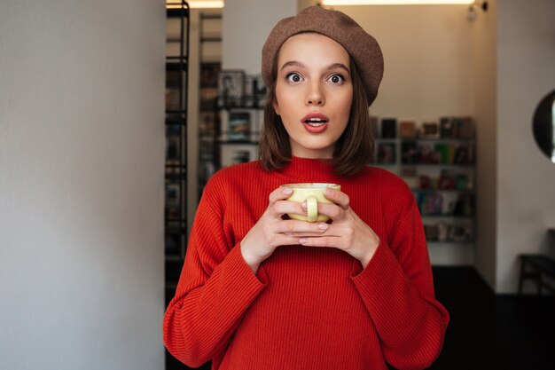 Portrait of a surprised girl dressed in sweater