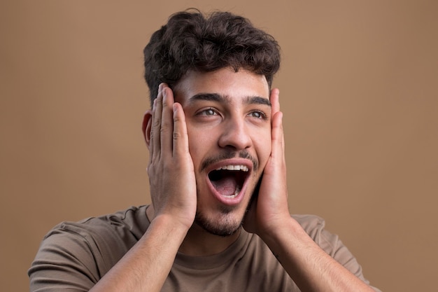 Portrait of surprised handsome man