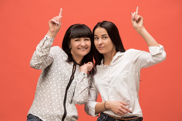 A portrait of a surprised mother and daughter at studio