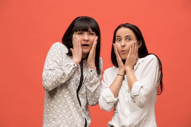 A portrait of a surprised mother and daughter