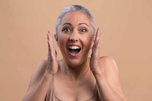 Portrait of surprised older woman