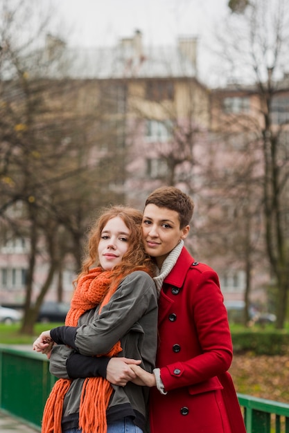 Free photo portrait of sweet women hugging