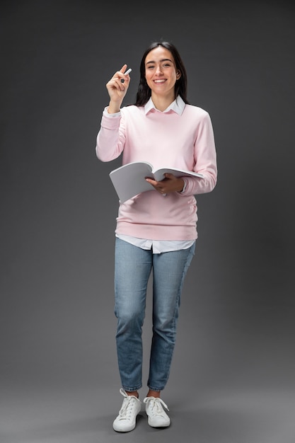 Portrait teacher female holding book