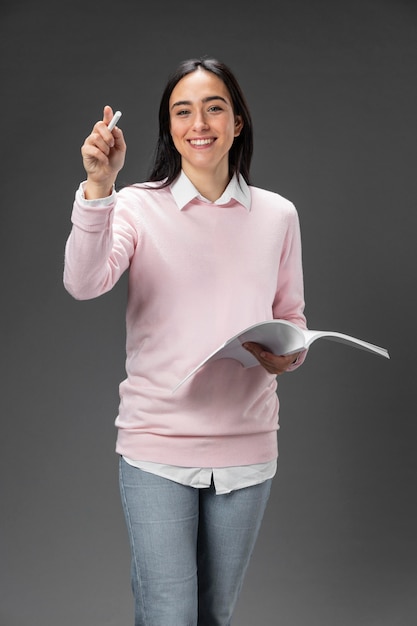 Portrait teacher female holding book