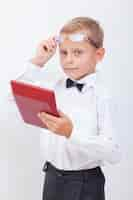 Free photo portrait of teen boy with calculator on white