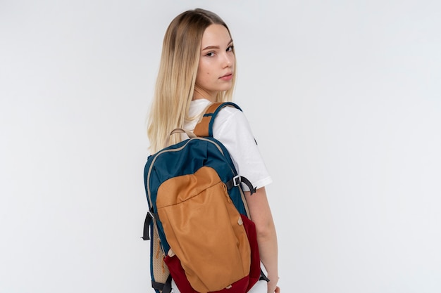 Portrait of a teen girl holding her backpack