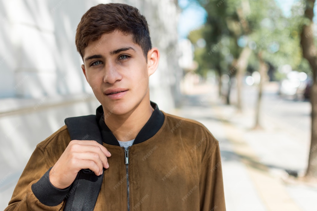 portrait-teenage-boy-carrying-bag-looking-camera_23-2148088760.jpg