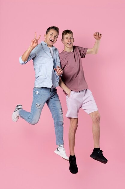 Portrait of teenage friends jumping