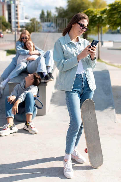 Portrait of teenage girl next to her friends