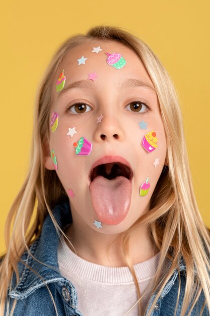 Portrait of teenage girl keeping her tongue out