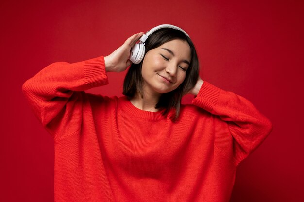 Portrait of a teenage girl listening to music