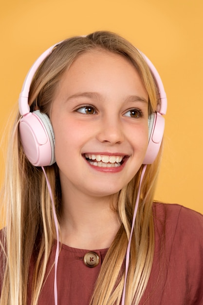 Portrait of teenage girl listening to music