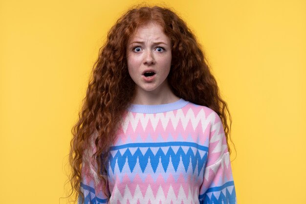 Portrait of teenage girl looking shocked