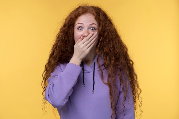 Portrait of teenage girl looking shocked