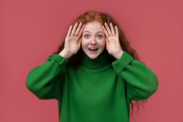 Portrait of teenage girl playing pick a boo