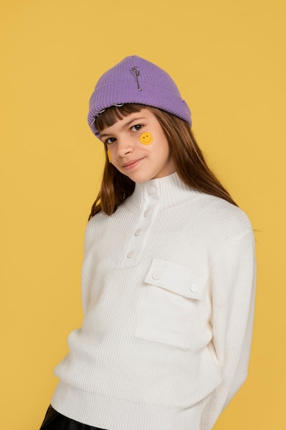 Portrait of teenage girl posing and wearing a beanie