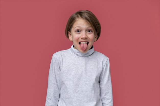 Portrait of teenage girl sticking her tongue out