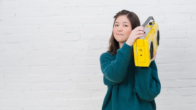 Portrait of teenage girl with music concept