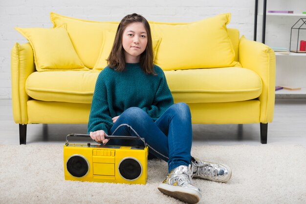 Portrait of teenage girl with music concept