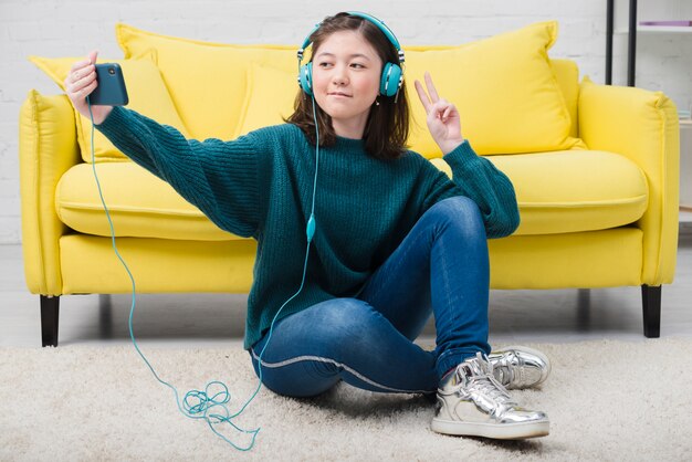 Portrait of teenage girl with music concept
