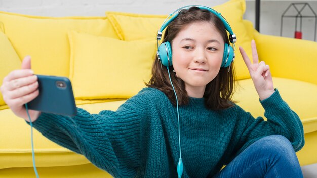 portrait of teenage girl with music concept