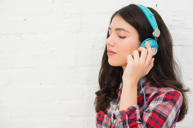 Portrait of teenage girl with music concept